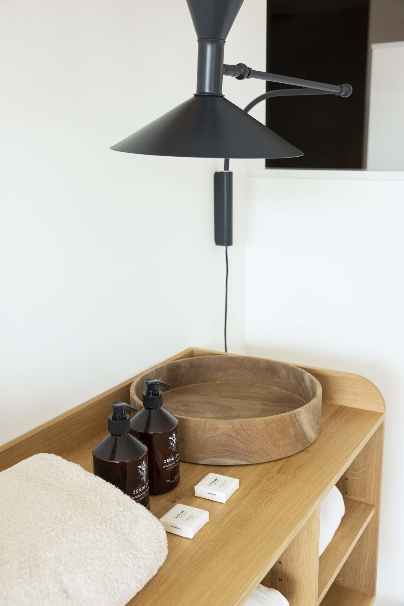 A designer lamp and luxury products in the wellness.